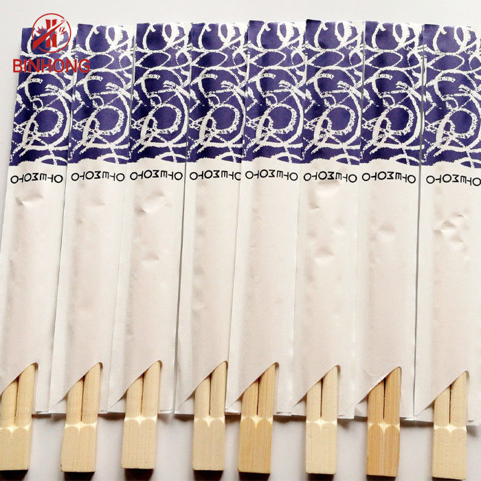 Hashis de bambu chineses de Tensoge para o restaurante, meio envoltório do papel