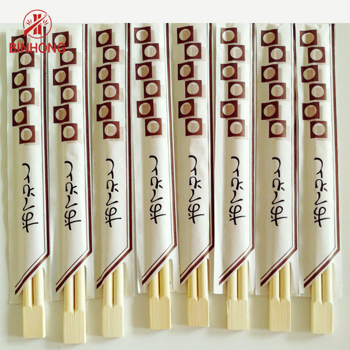 Hashis de bambu chineses de Tensoge para o restaurante, meio envoltório do papel