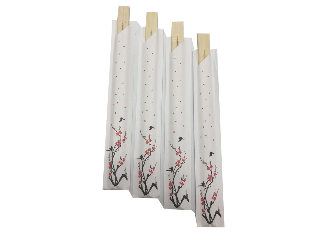 A luva de papel descartável junta os hashis de bambu para restaurantes